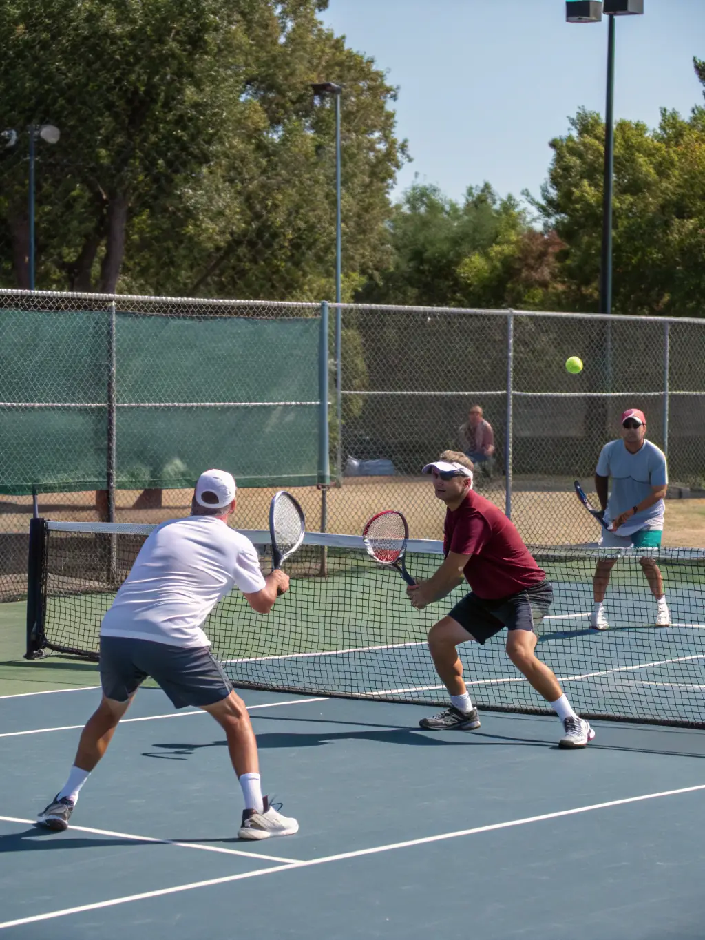 A vibrant image of a mixed doubles tennis tournament in progress at TENNIS CLUB MUNICIPAL DE PREUILLY, showcasing teamwork and competition.